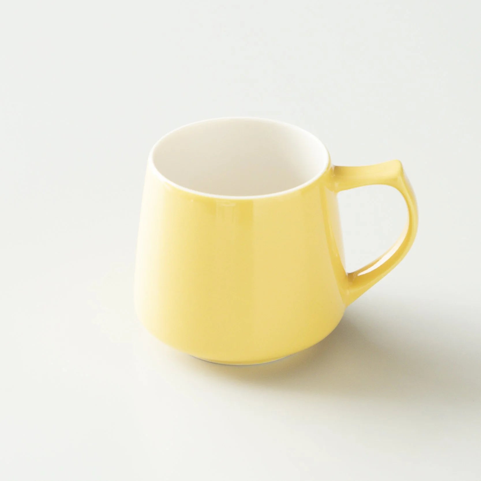 Yellow mug on a light gray background #yellow